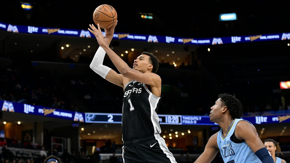 FILE - San Antonio Spurs center Victor Wembanyama (1) shoots ahead of Memphis Grizzlies forward GG Jackson (45) in the first half of an NBA basketball game April 9, 2024, in Memphis, Tenn. Wembanyama stole the show with spectacular one-handed dunks as France warmed up for its Paris Olympics gold medal bid with a 96-46 rout of Turkey.  - (AP Photo/Brandon Dill, File)


